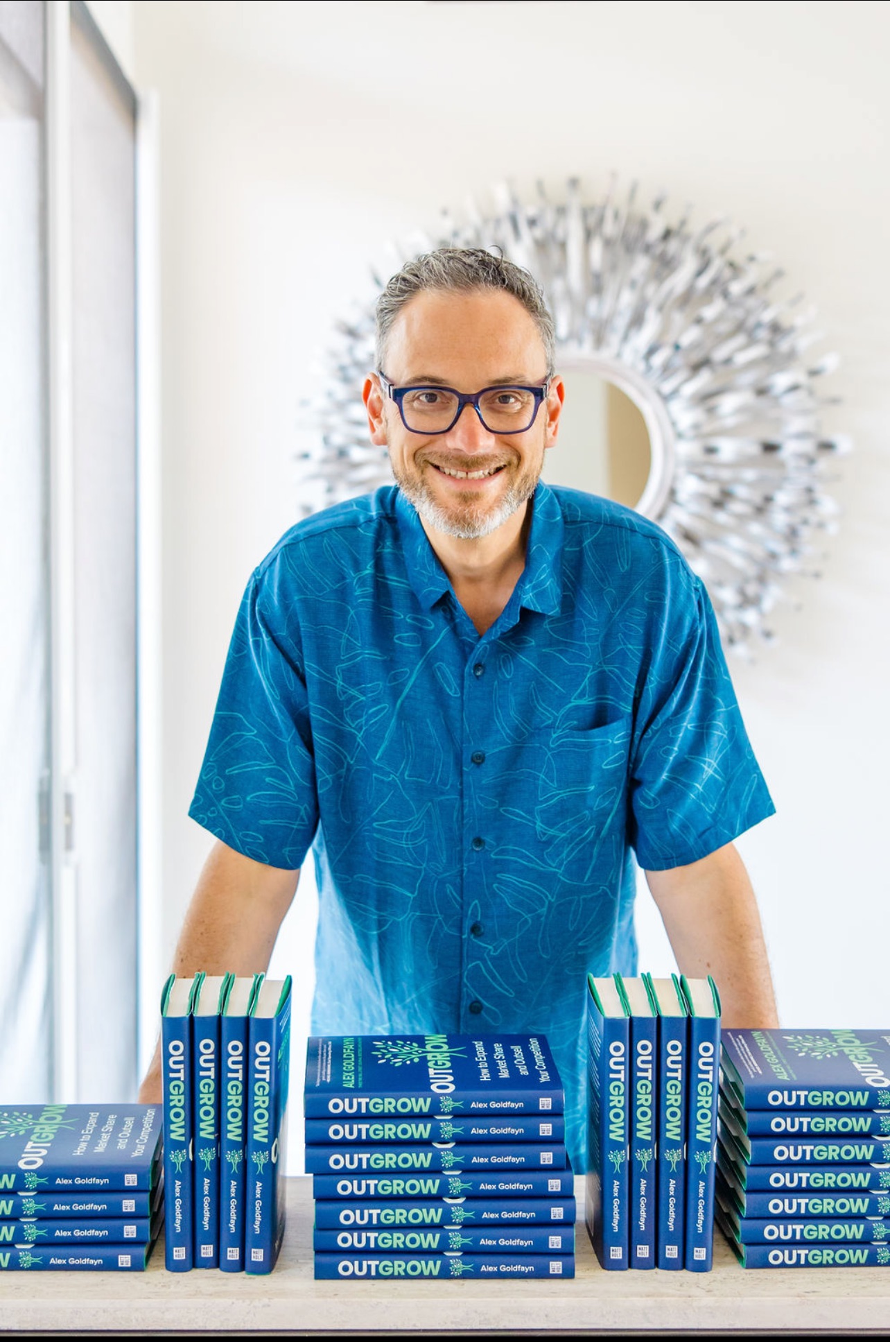 Alex Goldfayn with Outgrow books
